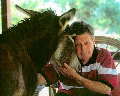 Cleveland Amory with Friendly the burro.